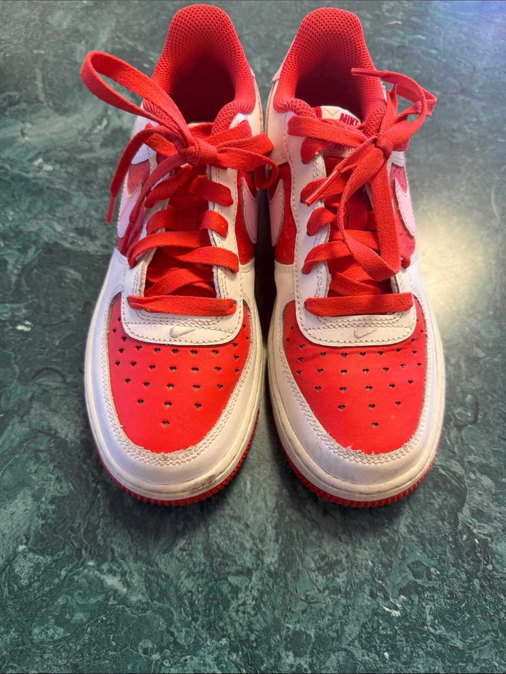 Nike Kids Red and White Low-Top Sneakers with Bold Swoosh